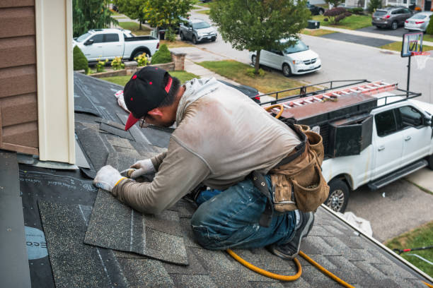 Professional Flat Roof Repair technician working in Fraser, MI